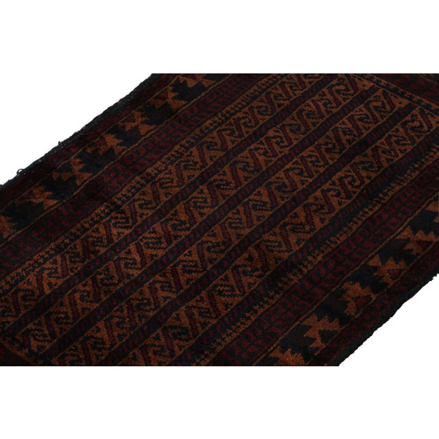 Hand knotted in wool, this 2x4 Baluch rug represents a new line of tribal carpets in the Modern Classics Collection by Rug...