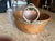 French copper pot measuring 11.5” in diameter. The height of the pan is 4.25” deep. There are 2 brass circular handles 7”....