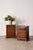 Pair of Georgian-style burl bedside chests, three drawers, brass bail pulls, and bracket feet.