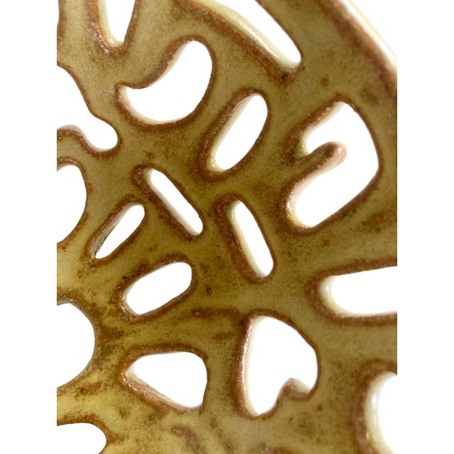 A Quirky Vintage Handcrafted Earthenware Catchall Bowl with cut out shapes. Pale yellow glaze. Unsigned.