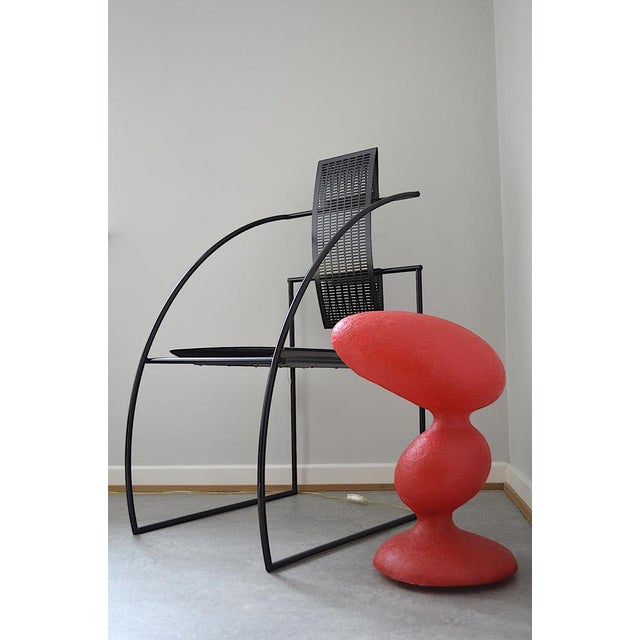 The lamp was designed by Guglielmo Berchicci in the 1990s, the vibrant era of postmodern design. Its design makes the...