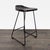 This Pottery Barn counter stool features a sleek, curved wood seat and sturdy black metal legs. The modern, minimalist...