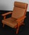 Hans j. Wegner lounge chair made of solid stained beech. New upholstered with vintage tan aniline leather. Model 290a,...