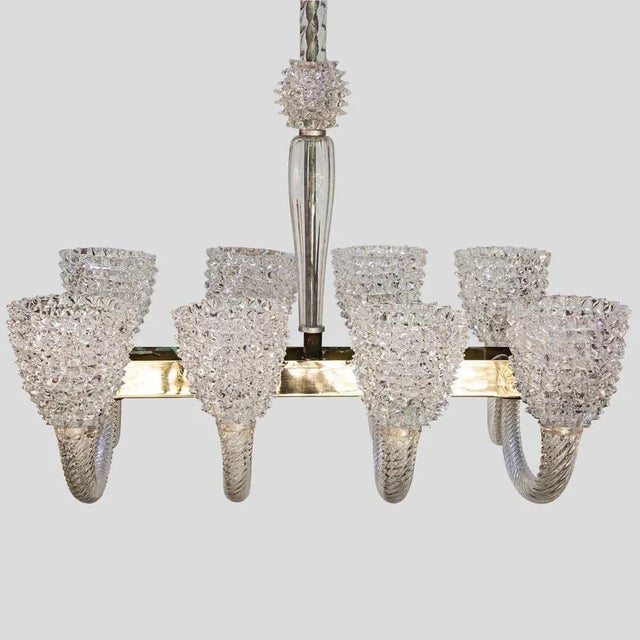 A magnificent 8 arms Rostrato chandelier by Barovier and Toso in Pulegoso technique clear glass 8 lighter Made in Italy...