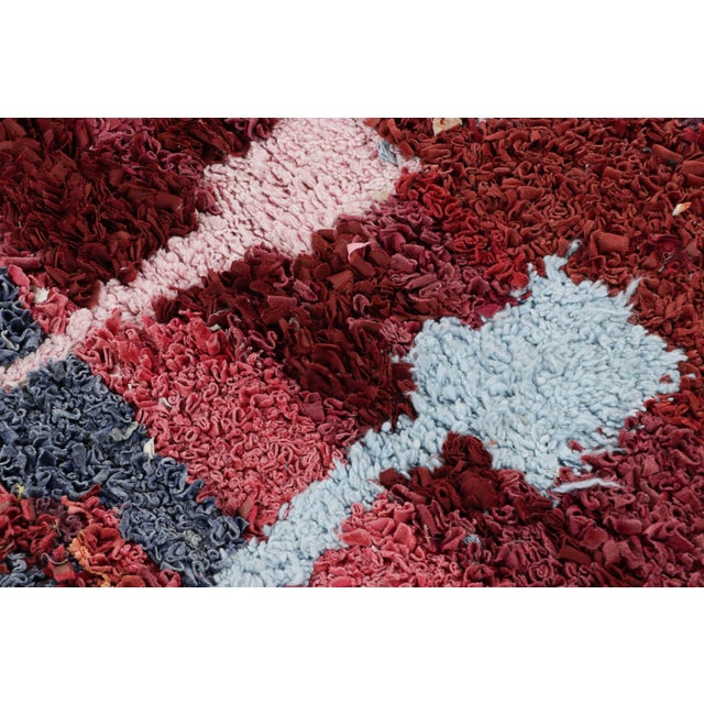 Hand-knotted in wool and originating from Morocco circa 1950-1960, this 4x5 vintage rug is a rare and among the most...