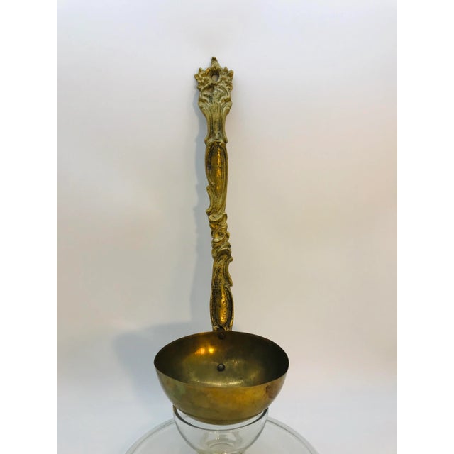 Vintage English brass soup ladle. Very heavy cast brass.
