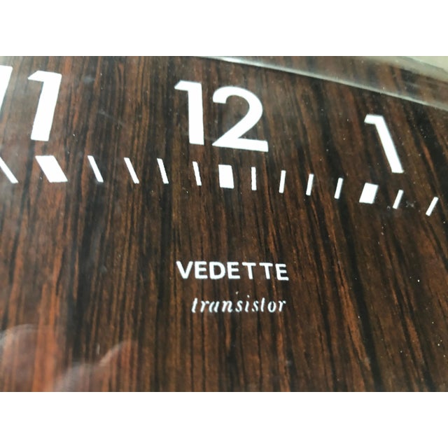 It works with a battery and you have to put the button on the back to start This piece has an attribution mark, I am sure...