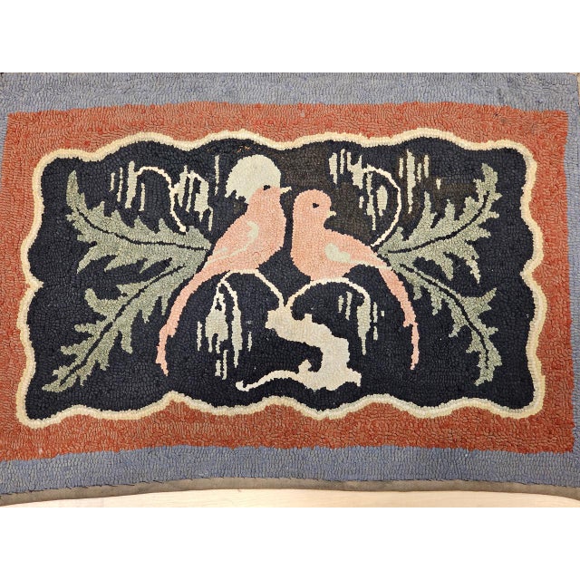 A charming and whimsical example of early American textile folk art, this hand-hooked rug from the early 20th century...