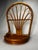 This vintage-style wall shelf is crafted from natural bamboo and rattan, featuring a prominent arched backrest with a...