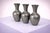 A refined and minimalist set of three pewter vases designed by Schreuder & Olsson, Sweden, circa 1970. Each vase features...