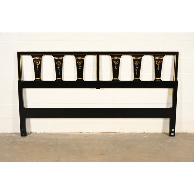 A beautiful mid-century Hollywood Regency or Neoclassical style black lacquered and gold gilt king size headboard By John...