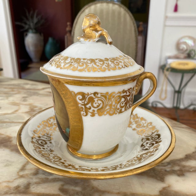 Gorgeous old Paris large covered cup and saucer set. The hand painted portrait is very well done and exhibits beautiful...