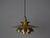 The lamp's form was designed based on the principle of a reflective system that directs light not only downward but also...