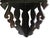 Striking petite, vintage wall-mounted corner shelf featuring an elaborate openwork carved-wood design in a gloss black...