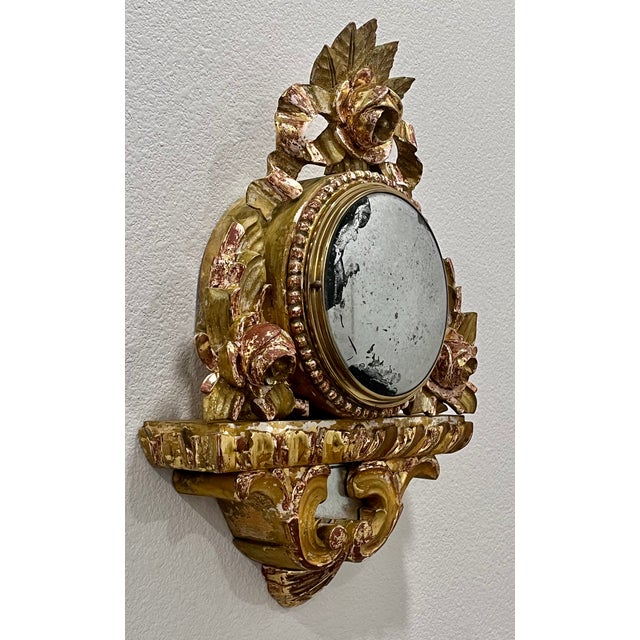 Unique wall decor. Antique French gilt wood clock housing with convex glass front refinished with a mercury glass mirrored...