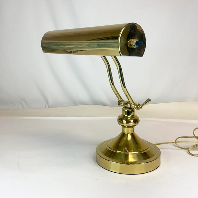 This style of lamp is referred to as a Piano Lamp because it would sit on the piano above the sheet music giving it light...