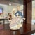 A Lladro Evita porcelain figurine, model #5212, from the Girls with Parasols collection. Introduced in 1984 and produced...