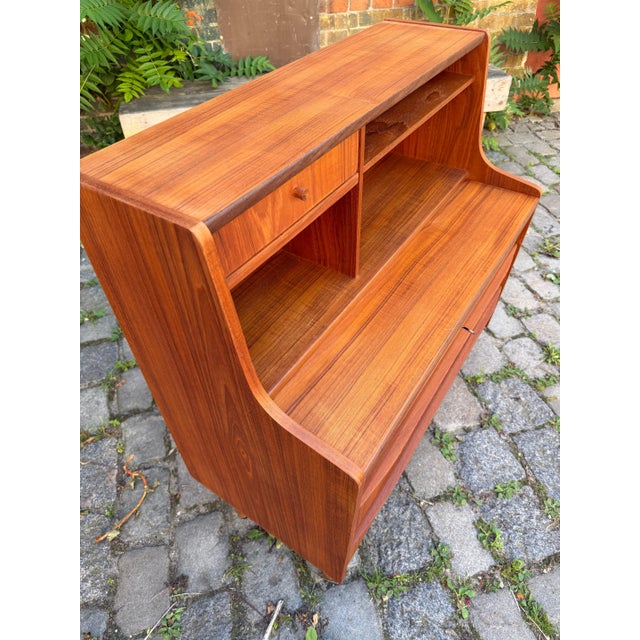 A clever space-saving marvel from Scandinavia: This Danish teak secretary desk from the 1960s is a multifunctional piece...