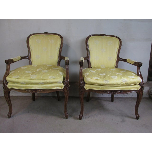 Vintage pair French Louis XV Style fauteuils by Hickory Furniture Company, circa 1970. Silk upholstery with hand carved...