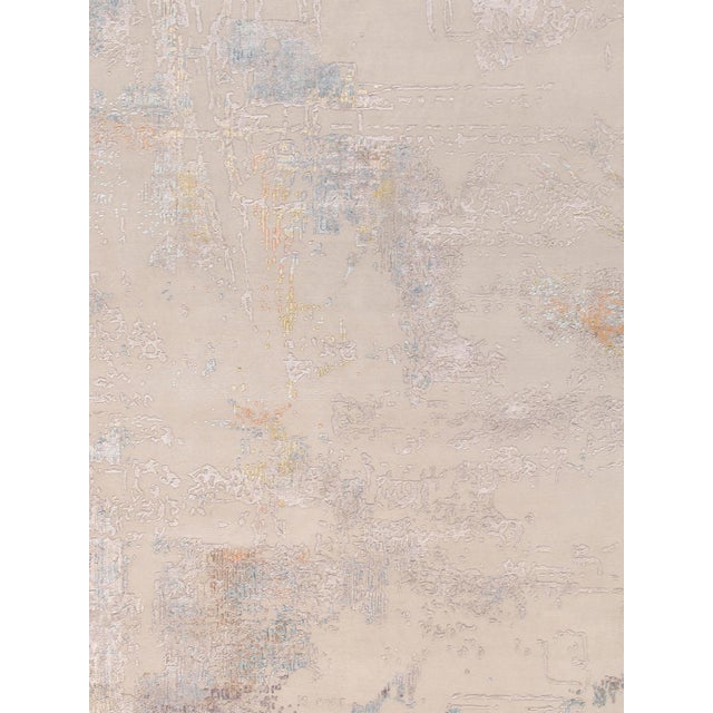 The Modern Collection explores hand-knotted designs through abstract patterning, solid tonal fields, and subtle surface...