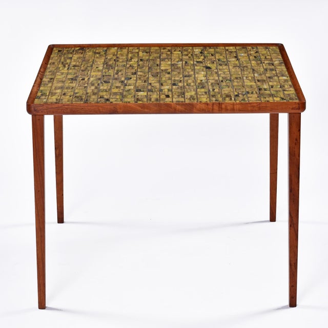 We’ve never seen a tile top Danish teak cocktail table with this captivating tile design. Each tile is a completely...