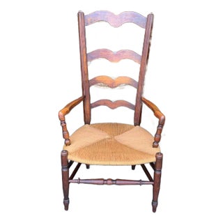 Early 20th Century Rustic French Country Style High Ladder Back Rush Seat Open Armchair For Sale