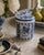A charming mid-20th-century Dutch Delft covered sugar jar, decorated in classic cobalt blue on white with floral motifs,...