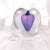 This is a small signed Zellique perfume bottle. It is heart shaped with purple in the cernter and an iridescent sheen to...