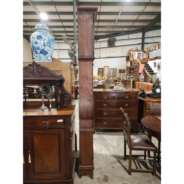 A tall and beautifully proportioned 19th-century French provincial longcase clock featuring a traditional Comtoise...