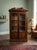 This piece is a classic Biedermeier style double-door bookcase vitrine, characterized by the clean lines, understated...