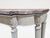 The breakfront rectangular breccia marble top over the conforming stop-fluted frieze fitted with two drawers and centered...