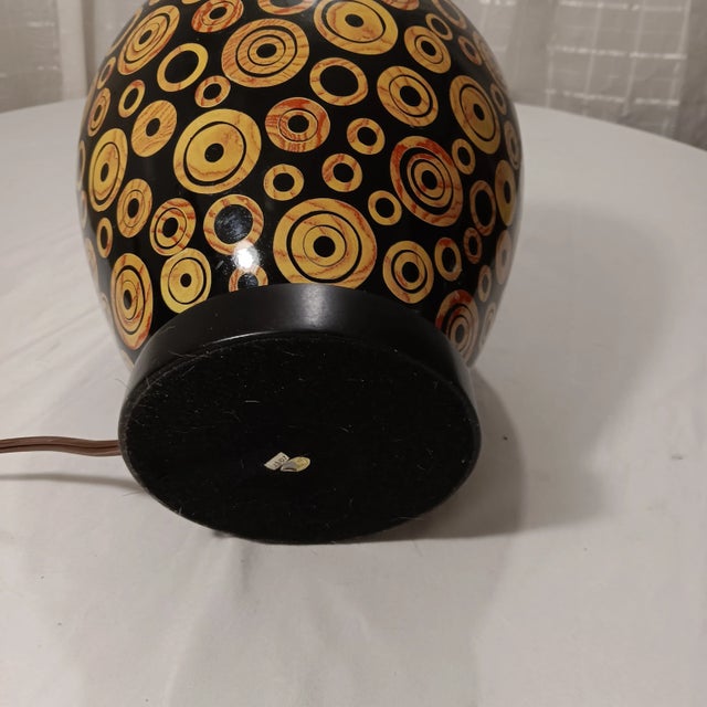 Vintage Mid-Century Modern Wood Lamp With Black Base Color and Embellished With Light Tan Circles With a Touch of Red Grain Lines For Sale - Image 12 of 12