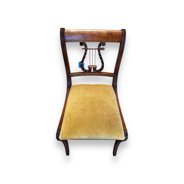 Elegant and timeless, this vintage harp back chair features a beautifully carved lyre-shaped backrest that brings a touch...
