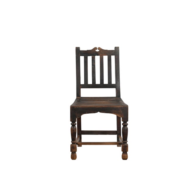 This Vintage Indian Teakwood Chair is handcrafted from solid teakwood and designed with a timeless simplicity that remains...