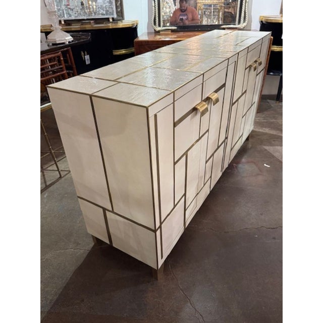 Vintage Italian designer textural side cabinet with geometric brass inlay. This is a stunning piece in person. Circa 1960....