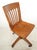 Antique swivel quarter sawn oak office chair with a dark stain. It features a vertical back slatted design, a contoured...
