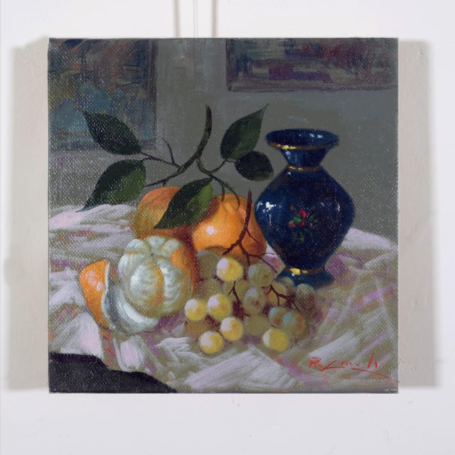 Arance e Uva" is a captivating oil painting by the renowned artist Renato Criscuolo, part of his early 2000s still life...