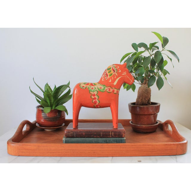 Vintage Orange Dala horse. A traditional Swedish hand-carved wooden sculpture featuring intricate painted details in...