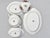 Elegant vintage Narumi China four-piece serving set featuring sprays of purple and ivory flowers, green foliage, and...