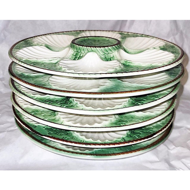Majolica, as popular today as ever, these 6 French St. Clement oyster plates are vibrant in their green glaze, fine...