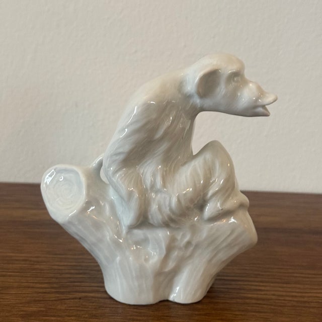 A French Art Deco white ceramic monkey creamer, featuring a sculptural figural primate form with a playful, stylized...