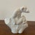 A French Art Deco white ceramic monkey creamer, featuring a sculptural figural primate form with a playful, stylized...