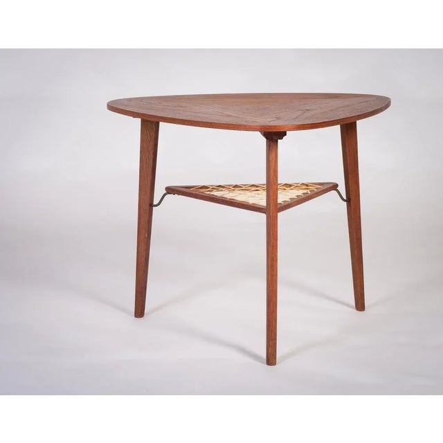 Triangular teak coffee table or side table designed by Holger Georg Jensen, Danish design, 1960s. The top is beautifully...