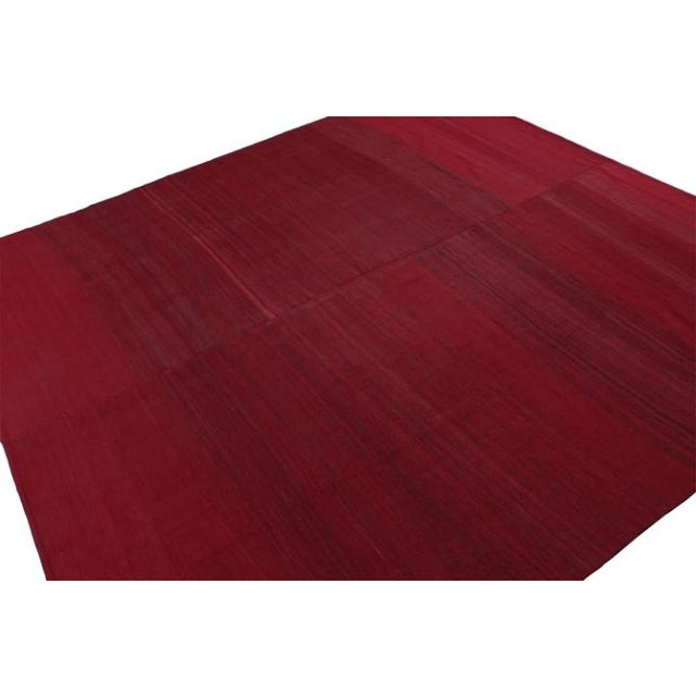 Handwoven in wool, this 9x9 vintage Afghan square kilim in deeply saturated wine red colors is woven from two larger...
