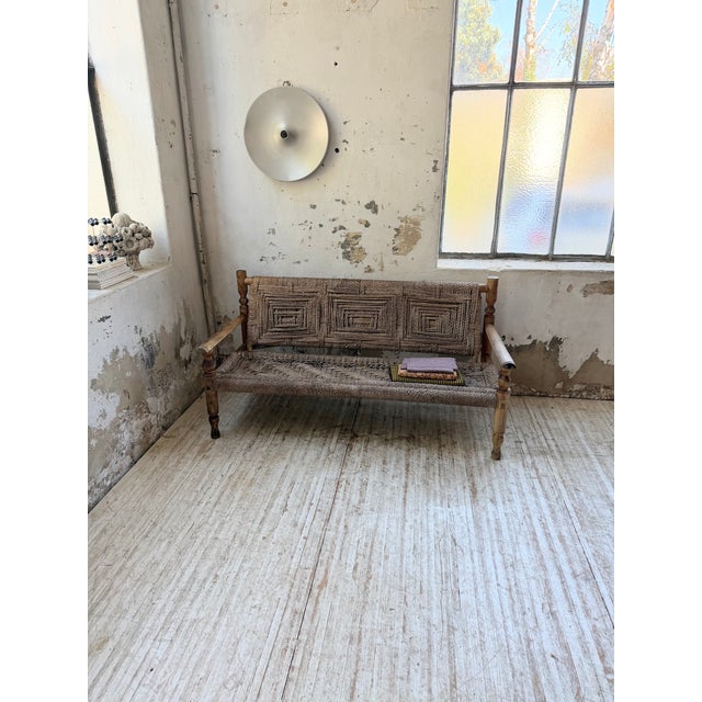 Antique beechwood bench with rope weaving, attributed to audoux and minet. the very elegant and graphic rope weaving on...
