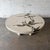 A sculptural Terra coffee table by Silas Seandel, combining cast concrete with the embedded bronze detail that makes this...