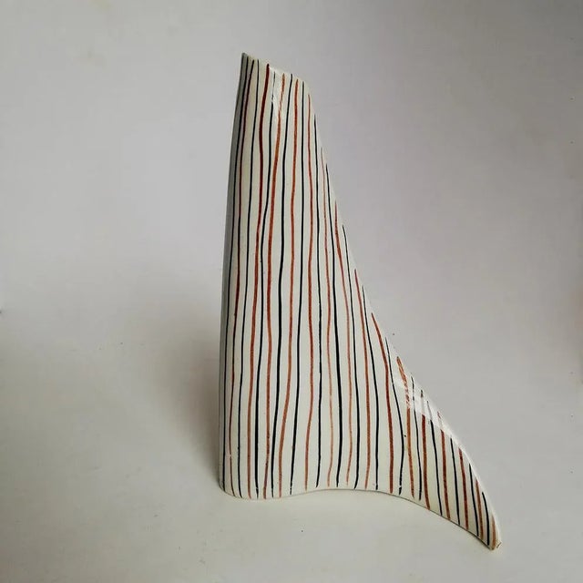 This piece is signed 'ICAM' (Industria Ceramica Artistica Missier).