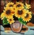 Captivating, large ceramic tile depicting a vase full of sunflowers with raised borders and a dark wood frame. Made in the...