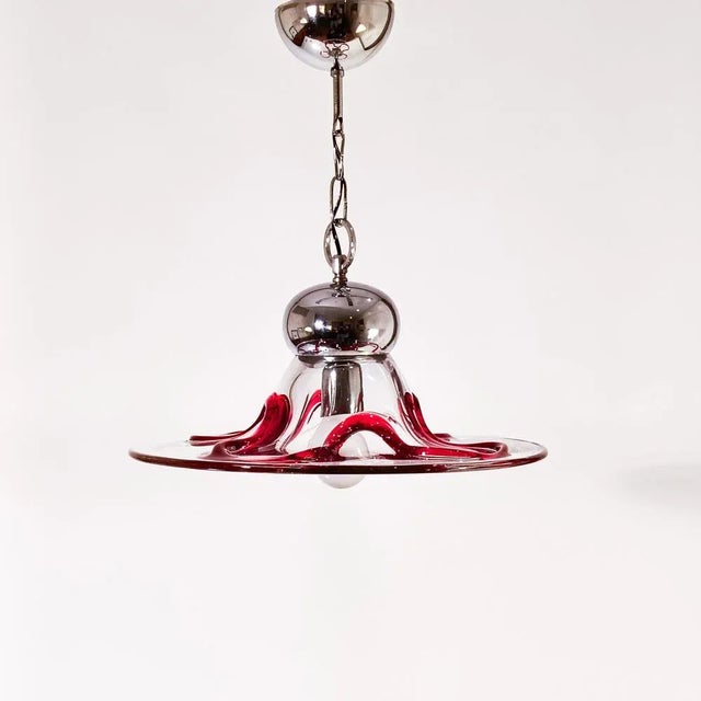 Postmodern Italian Murano glass ceiling lamp by Seguso Vetri d'Arte, 1980s. Body formed by a large piece of transparent...