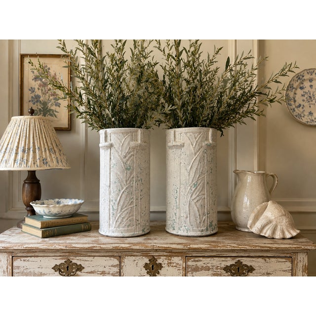This is a pair of whitewashed Art Deco style turquoise pottery umbrella stands or floor vases attributed to Brush McCoy...